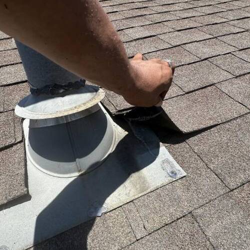 Roofer inspects roof