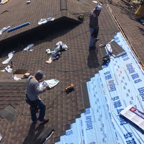 Roofers replace roof.